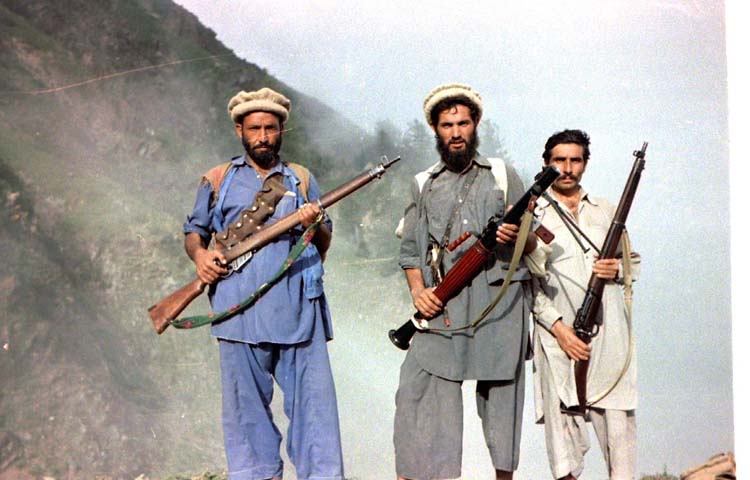 Mujahideen with Enfield rifles and rpg-7 on way up to Saohol Sar pass. Afghanistan, Kunar, august 1985