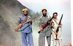 100_afghanistan,.kunar,.august.1985..mujahideen.with.enfield.rifles.and.rpg-7.on.way.up.to.saohol.sar.pass